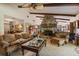 Inviting living room featuring a stone fireplace, exposed wood beams, and comfortable furnishings at 2918 Hardy Ave, New Smyrna Beach, FL 32168