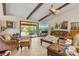 Comfortable living room with exposed ceiling beams and sliding glass doors at 2918 Hardy Ave, New Smyrna Beach, FL 32168