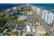 Aerial view of the condo, tennis courts and surrounding community near the beach, intercoastal and Halifax River at 3 Oceans West Blvd # 1D6, Daytona Beach Shores, FL 32118