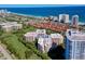 Beautiful aerial view showcasing the condo community, golf course, pristine beach and blue ocean waters at 3 Oceans West Blvd # 1D6, Daytona Beach Shores, FL 32118