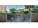 This unit features a private balcony with scenic views of lush landscaping, a gate, and a glimpse of the ocean at 3 Oceans West Blvd # 1D6, Daytona Beach Shores, FL 32118