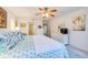 Cozy bedroom featuring a ceiling fan, neutral walls, and comfortable furnishings at 3 Oceans West Blvd # 1D6, Daytona Beach Shores, FL 32118