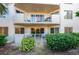 This property features a private balcony with a seating area, a lush garden, and easy access to nearby amenities at 3 Oceans West Blvd # 1D6, Daytona Beach Shores, FL 32118