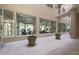 Fitness center with glass windows to the interior courtyard, potted plants and fitness equipment at 3 Oceans West Blvd # 1D6, Daytona Beach Shores, FL 32118
