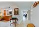 Long hallway featuring tile floor and wooden table at 3 Oceans West Blvd # 1D6, Daytona Beach Shores, FL 32118