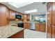 Kitchen with granite countertops, stainless steel appliances, wood cabinets, and recessed lighting at 3 Oceans West Blvd # 1D6, Daytona Beach Shores, FL 32118