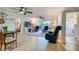 Bright living room with tile floors, ceiling fans, and access to balcony at 3 Oceans West Blvd # 1D6, Daytona Beach Shores, FL 32118