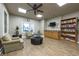 Comfortable lounge with seating, a tv, a bookcase, and a refreshment center for residents' enjoyment at 3 Oceans West Blvd # 1D6, Daytona Beach Shores, FL 32118