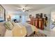 Main bedroom with a ceiling fan and plantation shutters, creating a peaceful retreat at 3 Oceans West Blvd # 1D6, Daytona Beach Shores, FL 32118