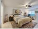 Comfortable main bedroom featuring a large bed, ceiling fan, and ample natural light at 3 Oceans West Blvd # 1D6, Daytona Beach Shores, FL 32118