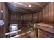 Wood paneled sauna area with wooden benches and heater at 3 Oceans West Blvd # 1D6, Daytona Beach Shores, FL 32118