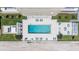 Aerial view of the stunning swimming pool with lounge chairs overlooking the ocean at 3000 N Atlantic Ave # 24, Daytona Beach, FL 32118