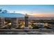 Stunning aerial view of beachfront condos, showcasing ocean and city views at twilight at 3000 N Atlantic Ave # 24, Daytona Beach, FL 32118