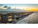 Picturesque aerial view of beachfront condos along the coastline, capturing ocean and city lights at 3000 N Atlantic Ave # 24, Daytona Beach, FL 32118