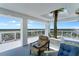 Inviting balcony space with a tropical palm tree, comfortable seating, and city skyline views at 3000 N Atlantic Ave # 24, Daytona Beach, FL 32118