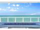 Breathtaking ocean view from the balcony with a modern glass railing and blue fire pit at 3000 N Atlantic Ave # 24, Daytona Beach, FL 32118