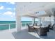 Expansive balcony featuring comfortable seating and a dining area, perfect for enjoying the ocean view at 3000 N Atlantic Ave # 24, Daytona Beach, FL 32118