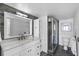 Updated bathroom with a marble countertop vanity and a glass enclosed shower at 3000 N Atlantic Ave # 24, Daytona Beach, FL 32118