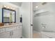 Bathroom featuring a modern vanity, neutral walls, and toilet at 3000 N Atlantic Ave # 24, Daytona Beach, FL 32118