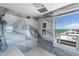 Walk-in shower with ocean views and elegant tile work at 3000 N Atlantic Ave # 24, Daytona Beach, FL 32118