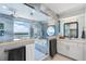 Bathroom with a large shower, soaking tub, and serene views from the window at 3000 N Atlantic Ave # 24, Daytona Beach, FL 32118