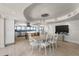 Dining area featuring a modern table, chairs, and adjacent to an open kitchen with stainless steel appliances at 3000 N Atlantic Ave # 24, Daytona Beach, FL 32118