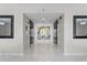 Entrance to elevators with attractive marble floors and wall art at 3000 N Atlantic Ave # 24, Daytona Beach, FL 32118