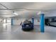 An indoor garage with multiple parking spots and charging capabilities at 3000 N Atlantic Ave # 24, Daytona Beach, FL 32118