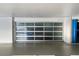 View of the glass paneled garage door at 3000 N Atlantic Ave # 24, Daytona Beach, FL 32118