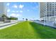 Beautifully maintained lawn area with convenient access to parking and building at 3000 N Atlantic Ave # 24, Daytona Beach, FL 32118
