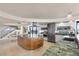 Gourmet kitchen island features a modern cooktop, stainless steel appliances, and adjacent dining area at 3000 N Atlantic Ave # 24, Daytona Beach, FL 32118