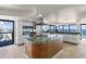 Gourmet kitchen island featuring a modern cooktop, ample counter space, and views of the ocean at 3000 N Atlantic Ave # 24, Daytona Beach, FL 32118