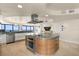 Modern kitchen island featuring a cooktop with contemporary stainless steel vent hood at 3000 N Atlantic Ave # 24, Daytona Beach, FL 32118