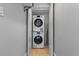 Functional laundry room with stacked washer and dryer, optimizing space and efficiency at 3000 N Atlantic Ave # 24, Daytona Beach, FL 32118