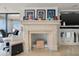 Elegant living space featuring a stone fireplace and memorabilia at 3000 N Atlantic Ave # 24, Daytona Beach, FL 32118