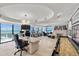 Expansive living space featuring breathtaking ocean views, a fireplace, and a custom workspace at 3000 N Atlantic Ave # 24, Daytona Beach, FL 32118