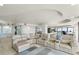 Open living room featuring a comfortable sectional sofa and views of the city at 3000 N Atlantic Ave # 24, Daytona Beach, FL 32118