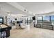 Large office space with multiple work areas, natural light, and ocean views, perfect for productivity at 3000 N Atlantic Ave # 24, Daytona Beach, FL 32118