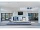 Outdoor patio features a cozy seating area with a fire pit, a TV, and beautiful water views at 3000 N Atlantic Ave # 24, Daytona Beach, FL 32118