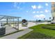 Outdoor pool area offering resort-style relaxation and grilling area at 3000 N Atlantic Ave # 24, Daytona Beach, FL 32118