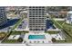 Enjoy the convenience of a private pool at the condo with tables, chairs and lounge chairs at 3000 N Atlantic Ave # 24, Daytona Beach, FL 32118