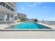 Relax in the pool with plenty of lounge chairs at the condo with ocean views at 3000 N Atlantic Ave # 24, Daytona Beach, FL 32118