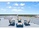 Relaxing rooftop deck with comfortable seating and panoramic views of the city and ocean at 3000 N Atlantic Ave # 24, Daytona Beach, FL 32118