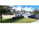 Lovely single-Gathering home with manicured lawn and a driveway with two cars at 313 Nowell Loop, Deland, FL 32724