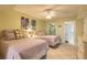 Inviting bedroom with two beds, soft lighting, and a glimpse into the en-suite bathroom at 3315 S Atlantic Ave # 1106, Daytona Beach, FL 32118