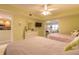 Comfortable bedroom showcasing soft decor, en-suite access, and access to the living area at 3315 S Atlantic Ave # 1106, Daytona Beach, FL 32118