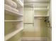 Organized walk-in closet with ample shelving and storage space at 3315 S Atlantic Ave # 1106, Daytona Beach, FL 32118