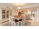 Elegant dining room with a table for six, adjacent to a modern kitchen with bar seating at 3315 S Atlantic Ave # 1106, Daytona Beach, FL 32118