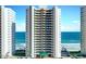 Beautiful high-rise beachfront condo building with ocean views and manicured landscaping at 3315 S Atlantic Ave # 1106, Daytona Beach, FL 32118
