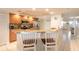 Stylish kitchen features granite countertops, stainless steel appliances, and breakfast bar seating at 3315 S Atlantic Ave # 1106, Daytona Beach, FL 32118